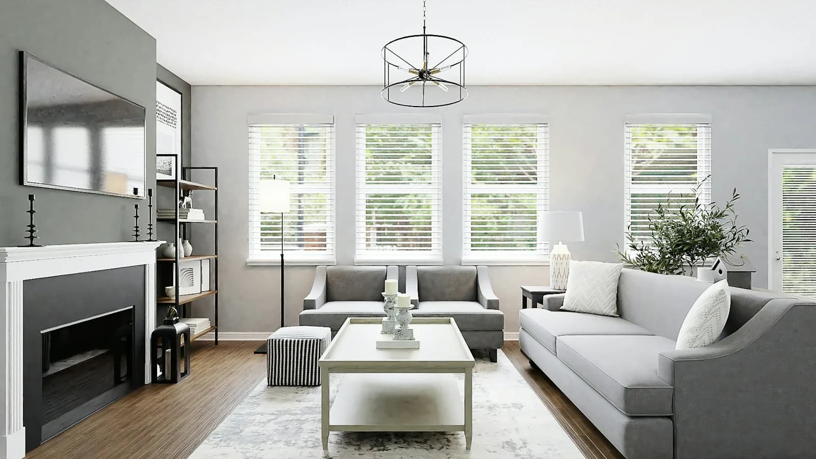 A bright room with light wood floors, a pale rug, and a window seat.